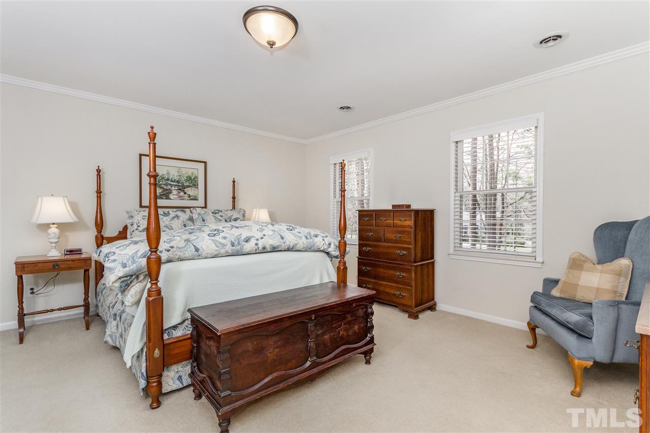 2408 Ridge Road Raleigh, NC 27612 - Photo 14 of 25 a bedroom with bed and a couch