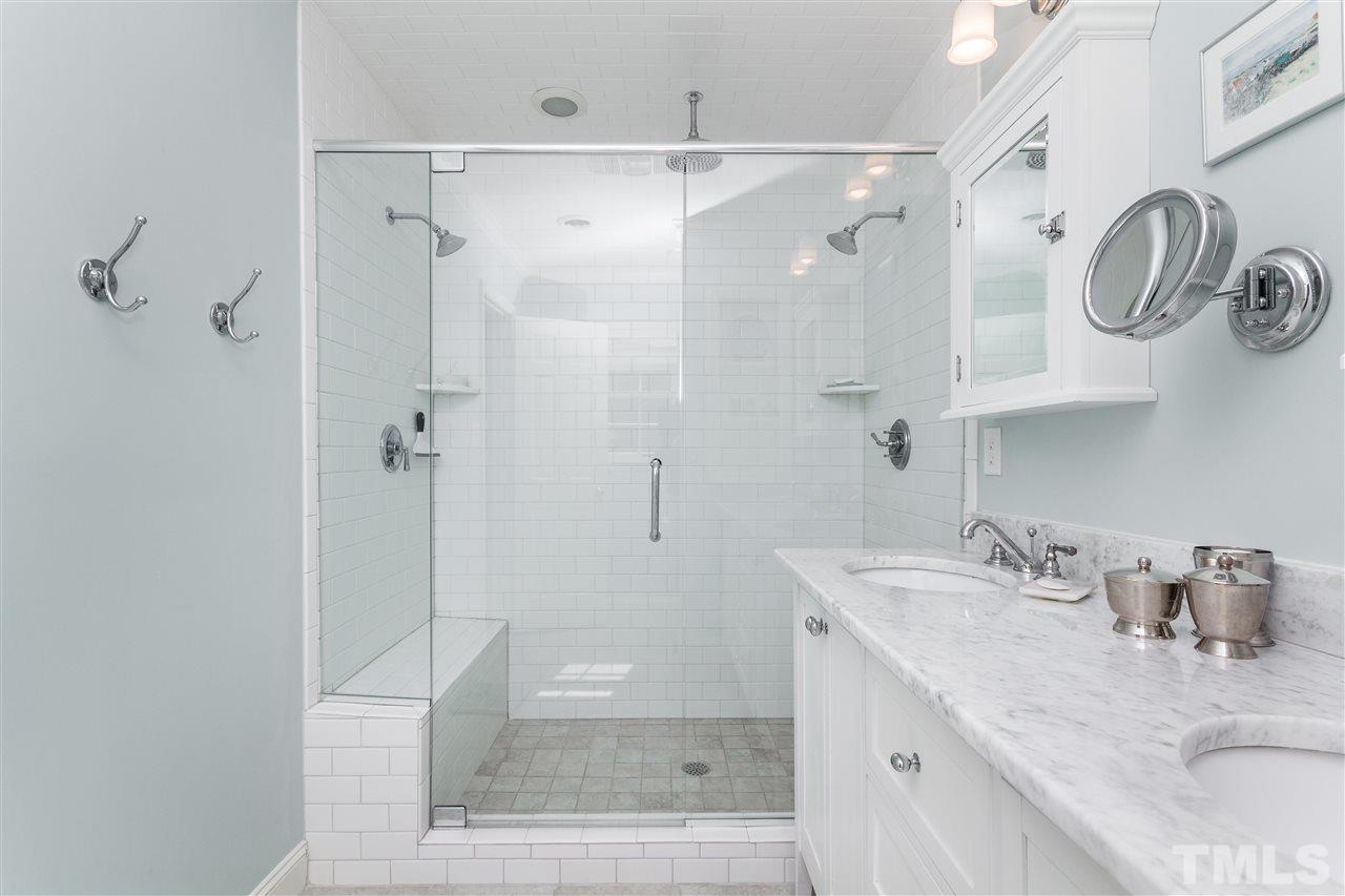 2408 Ridge Road Raleigh, NC 27612 - Photo 15 of 25 a bathroom with a granite countertop sink mirror and shower