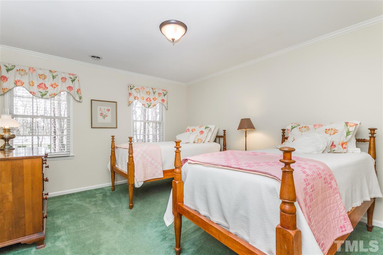 2408 Ridge Road Raleigh, NC 27612 - Photo 16 of 25 a bedroom with bed and a window