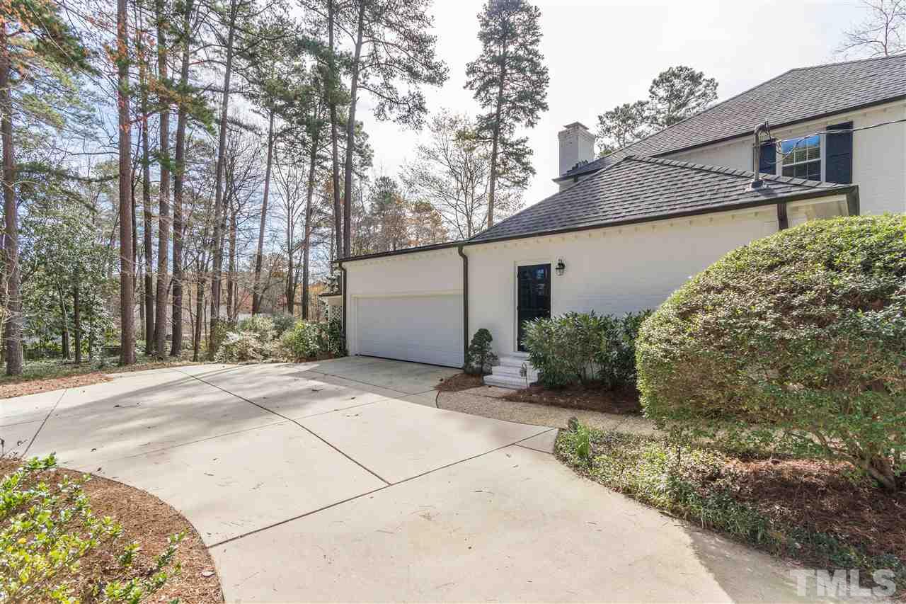 2408 Ridge Road Raleigh, NC 27612 - Photo 3 of 25 a view of a house with a backyard