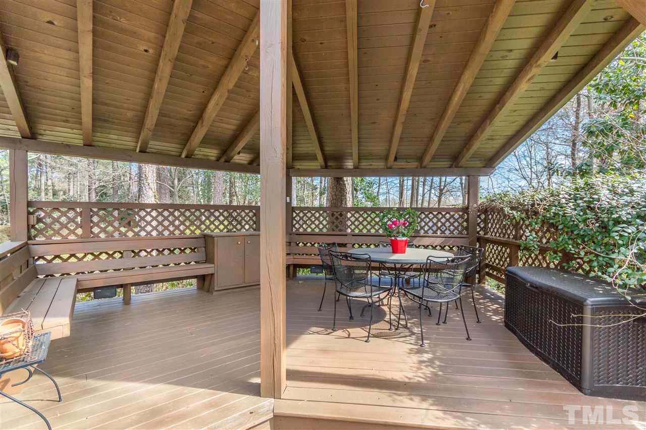 2408 Ridge Road Raleigh, NC 27612 - Photo 22 of 25 a room with patio furniture and wooden floor