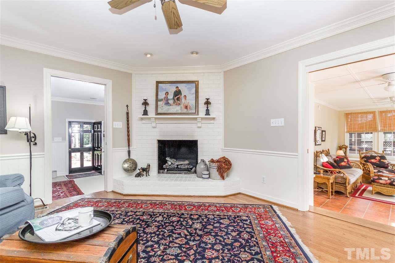 2408 Ridge Road Raleigh, NC 27612 - Photo 4 of 25 a living room with furniture and a fireplace