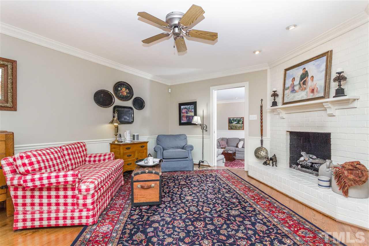 2408 Ridge Road Raleigh, NC 27612 - Photo 5 of 25 a living room with furniture and a fireplace