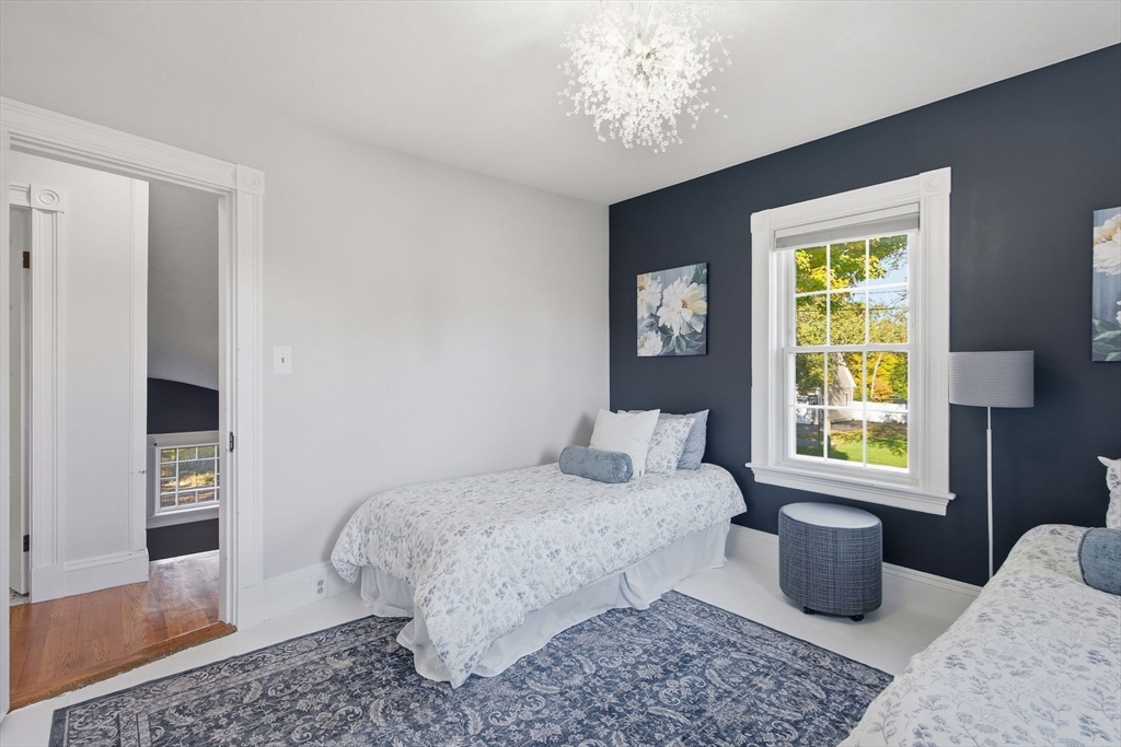 300 Greeley Street Clinton, MA 01510 - Photo 16 of 40 a bedroom with a bed and wooden floor