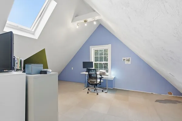 a view of workspace with furniture and a window