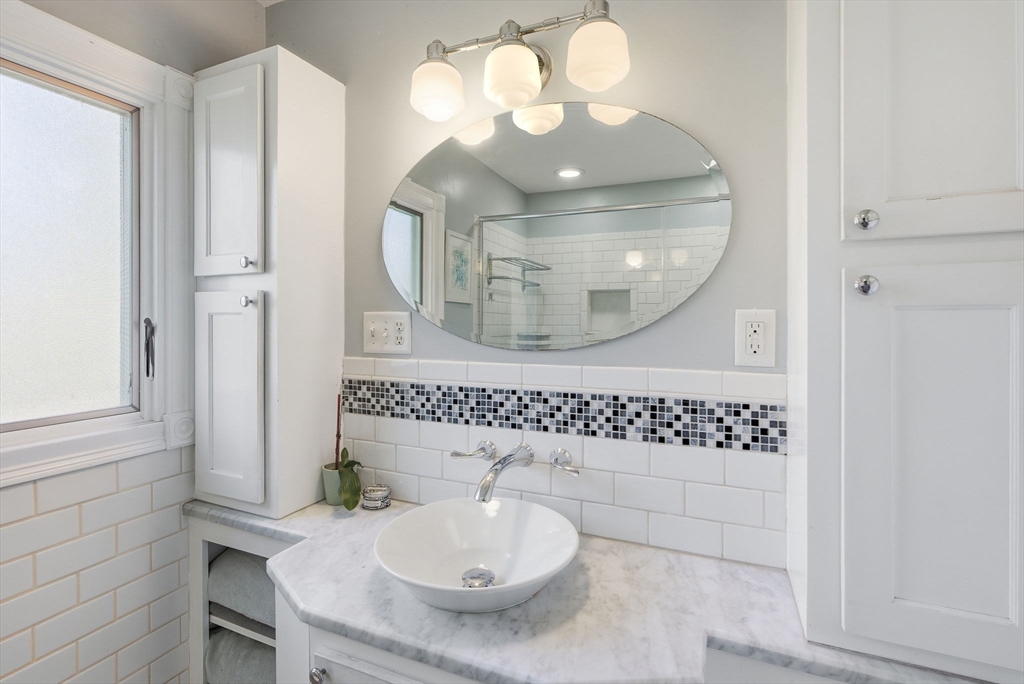300 Greeley Street Clinton, MA 01510 - Photo 21 of 40 a bathroom with a sink a light fixture and a mirror