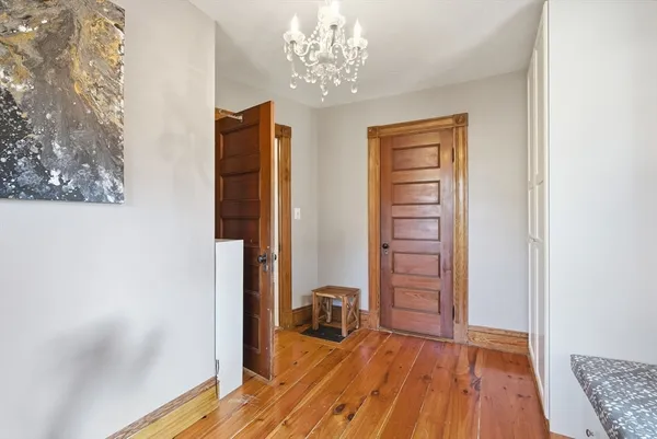 a room with wooden floor and closet