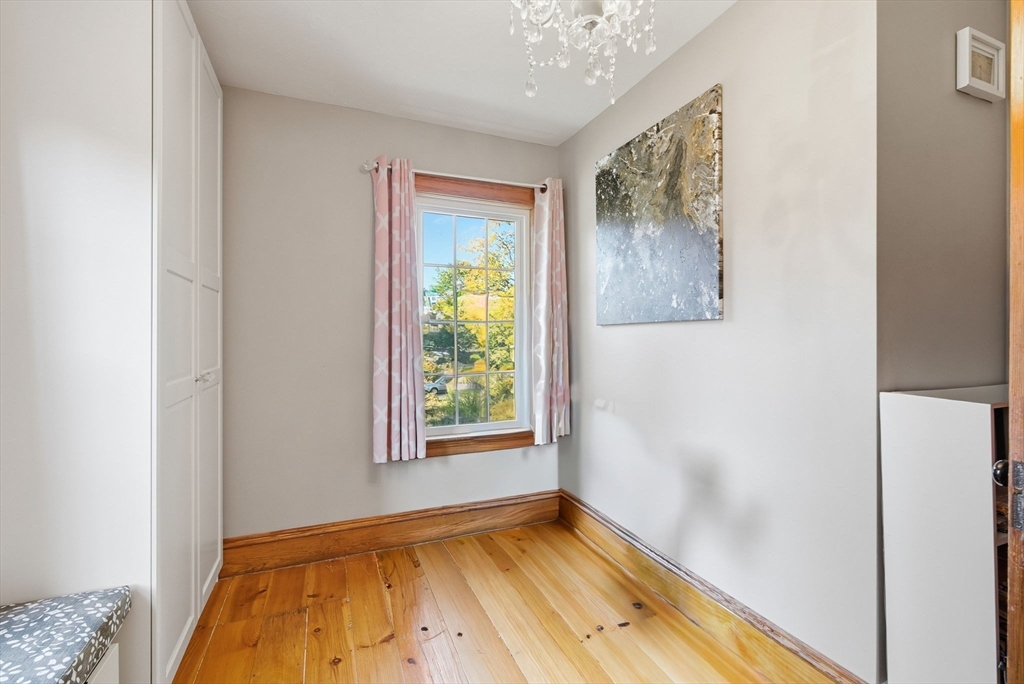 300 Greeley Street Clinton, MA 01510 - Photo 25 of 40 a view of an empty room with window and a bedroom