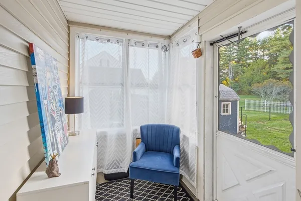 a view of a balcony with furniture and a window