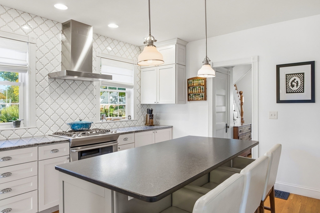 300 Greeley Street Clinton, MA 01510 - Photo 3 of 40 a kitchen with a table chairs microwave and cabinets