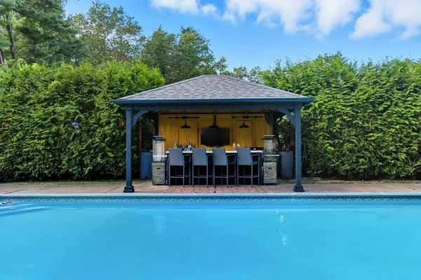 a view of a two chairs in the patio