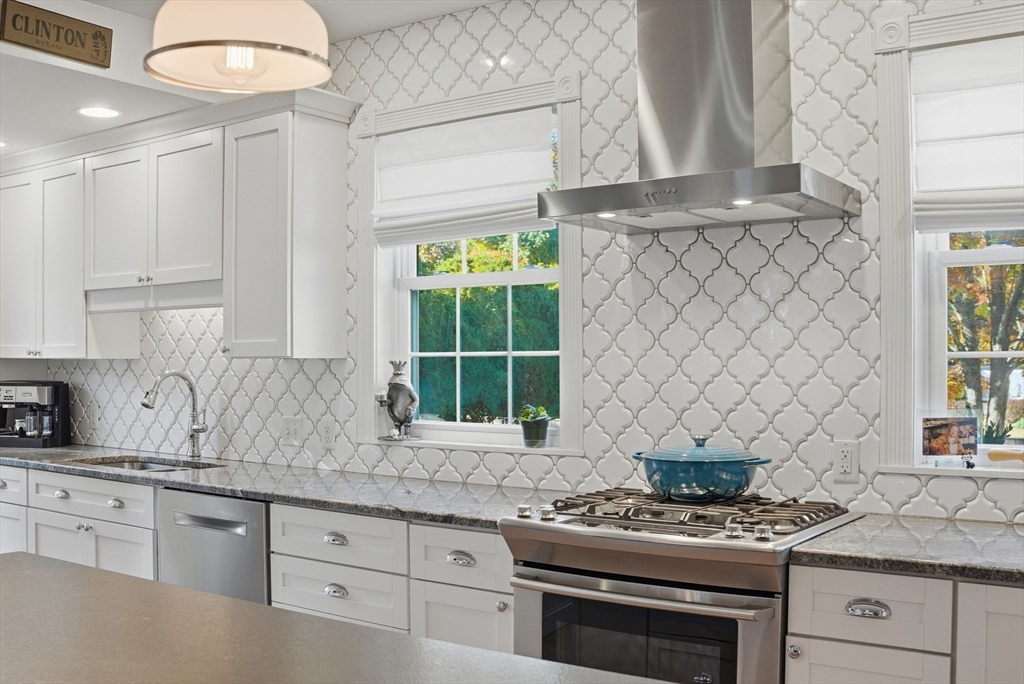 300 Greeley Street Clinton, MA 01510 - Photo 4 of 40 a kitchen with granite countertop a sink stove and cabinets