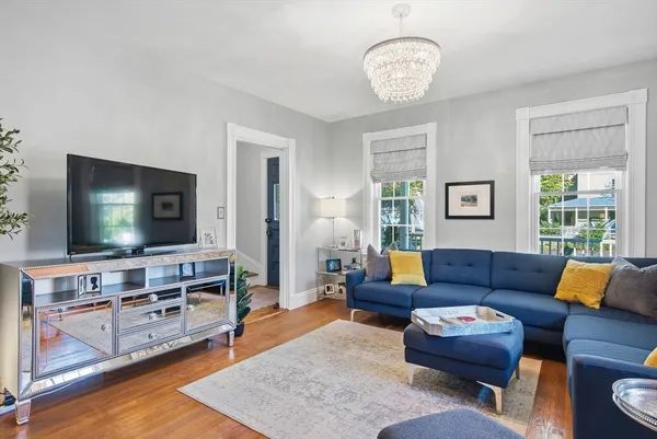 a living room with furniture and a flat screen tv