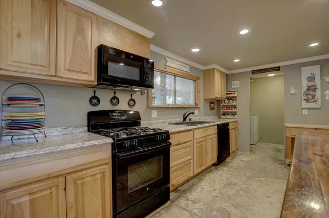 a living room with washer and a fireplace