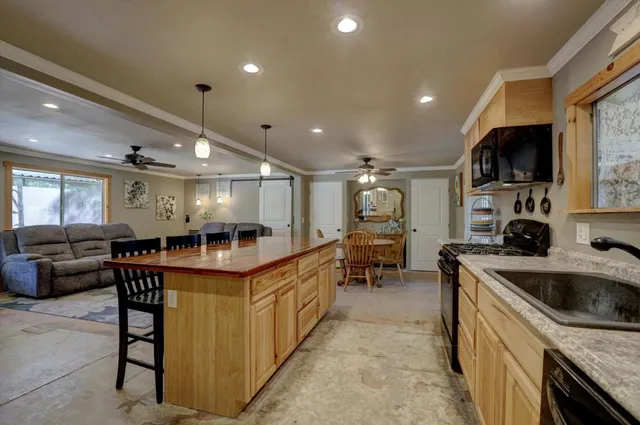 a bedroom with a bed and a tv