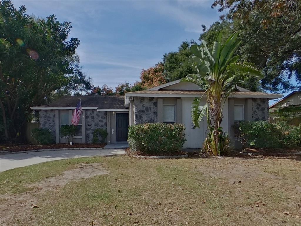 Undisclosed Address Seffner, FL 33584 - Photo 1 of 16 a front view of a house with a yard