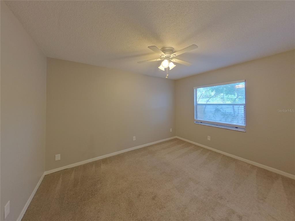 Undisclosed Address Seffner, FL 33584 - Photo 11 of 16 an empty room with a window