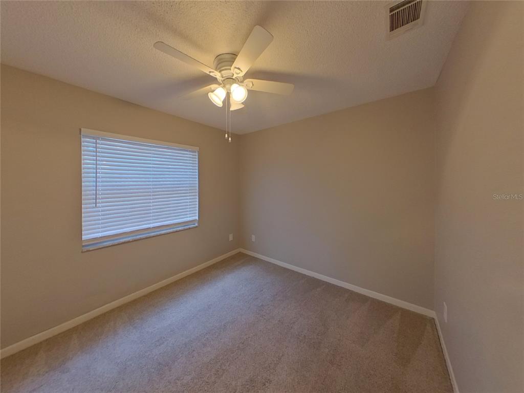 Undisclosed Address Seffner, FL 33584 - Photo 12 of 16 a view of an empty room with a window
