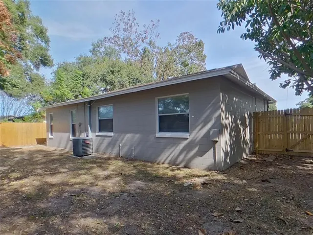 a house view with a backyard space