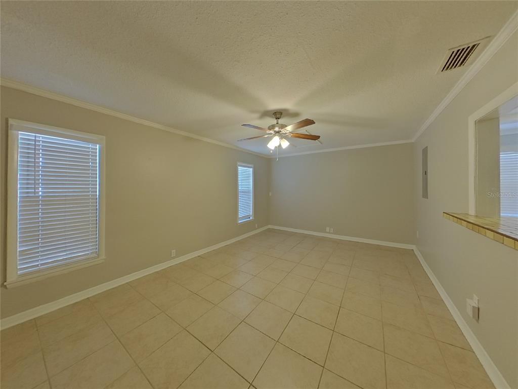 Undisclosed Address Seffner, FL 33584 - Photo 3 of 16 a view of an empty room with a window