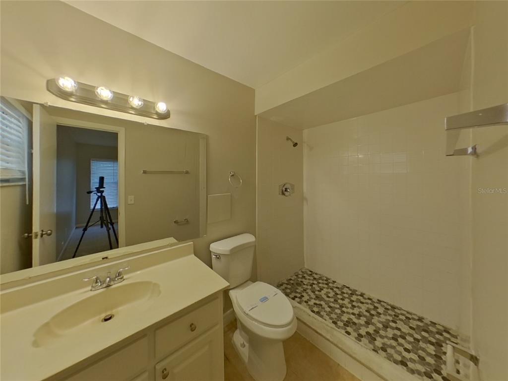 Undisclosed Address Seffner, FL 33584 - Photo 8 of 16 a bathroom with a sink toilet and shower