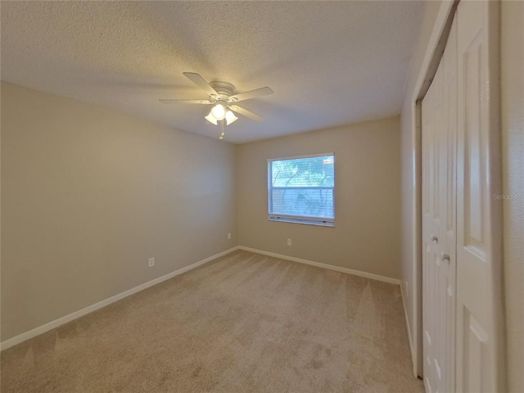 Undisclosed Address Seffner, FL 33584 - Photo 10 of 16 an empty room with a window