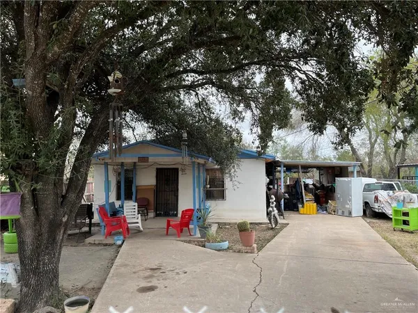 a view of a outdoor space with a tree and front view