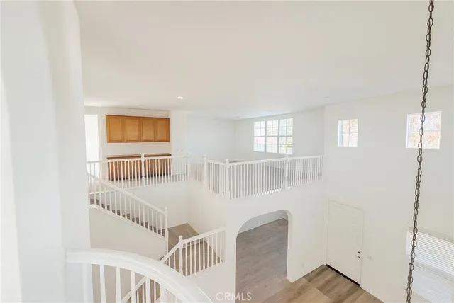 a view of a hallway with windows