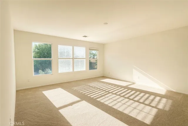 a view of an empty room and window