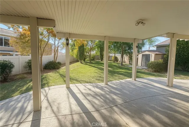 a view of porch with a floor to ceiling window and an outdoor view