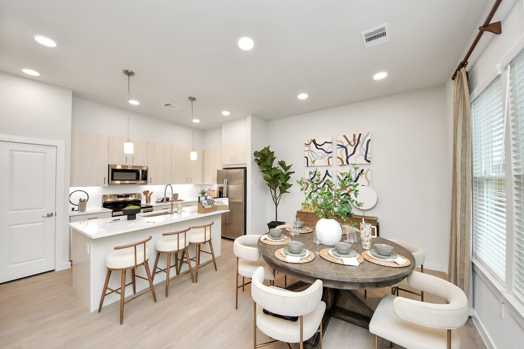 7306 Corey Rushing Lane Richmond, TX 77407 - Photo 7 of 50 a kitchen with a table and chairs in it