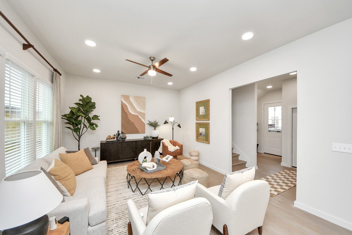 7306 Corey Rushing Lane Richmond, TX 77407 - Photo 12 of 50 a living room with furniture and a large window