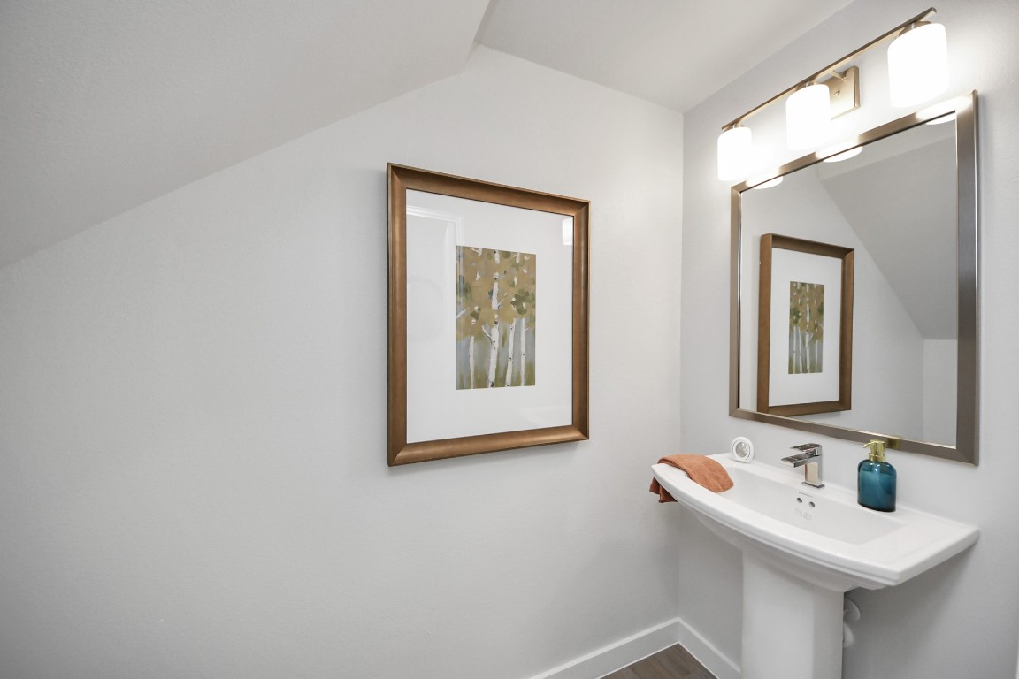 7306 Corey Rushing Lane Richmond, TX 77407 - Photo 14 of 50 a bathroom with a sink and a mirror
