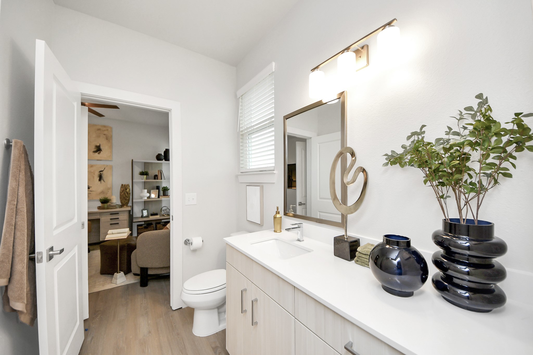 7306 Corey Rushing Lane Richmond, TX 77407 - Photo 17 of 50 a bathroom with a sink a toilet and a mirror