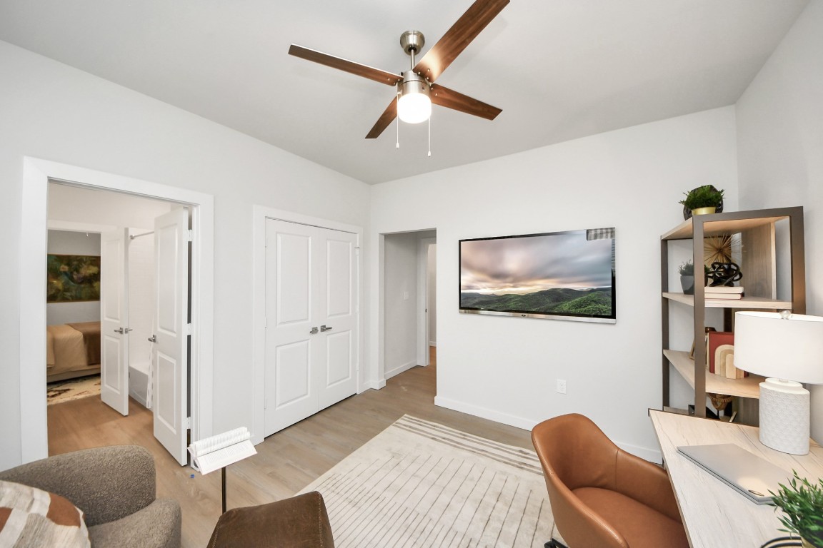 7306 Corey Rushing Lane Richmond, TX 77407 - Photo 21 of 50 a bedroom with furniture and a chandelier fan