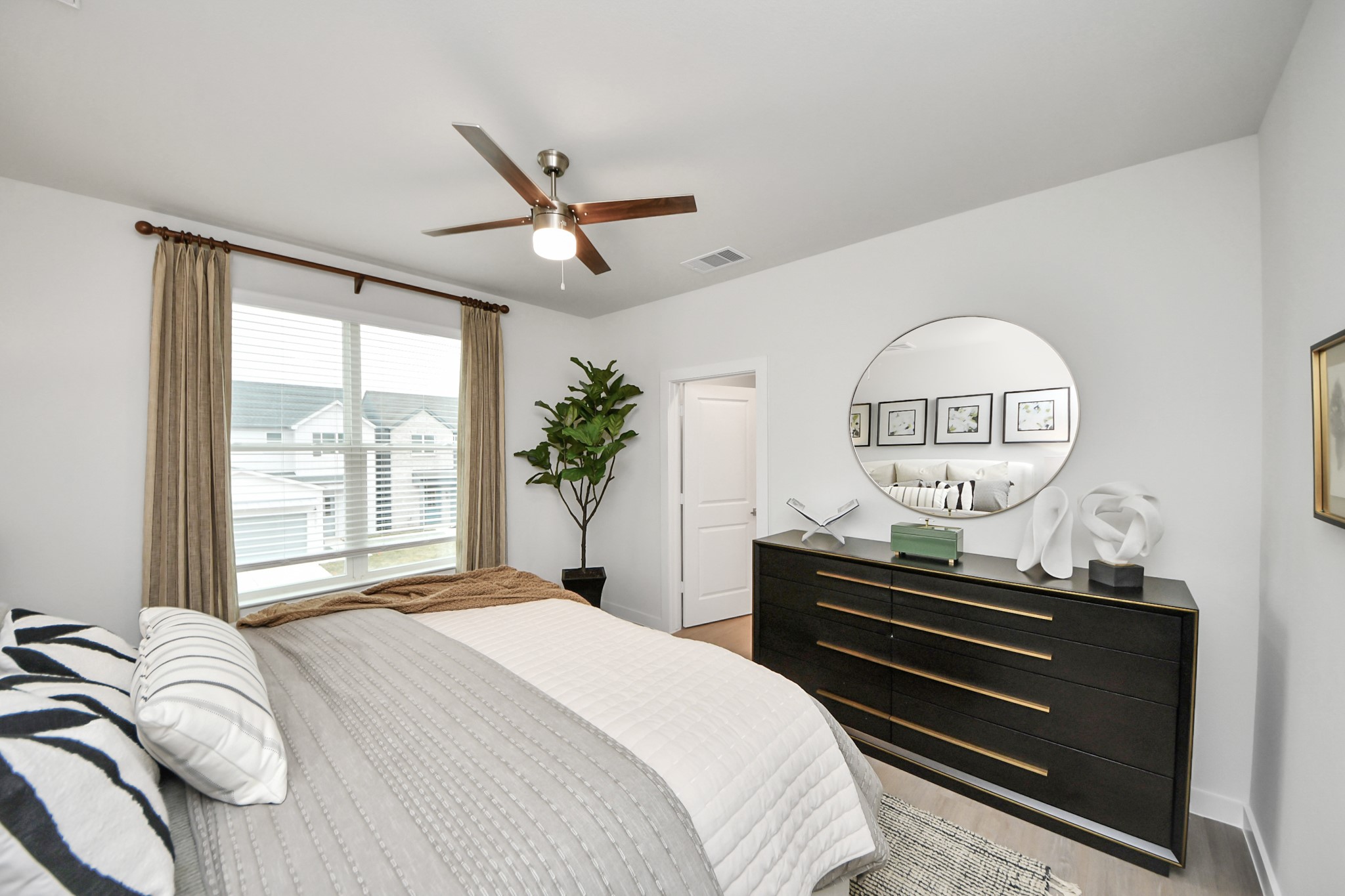 7306 Corey Rushing Lane Richmond, TX 77407 - Photo 24 of 50 a bedroom with a bed and a large window