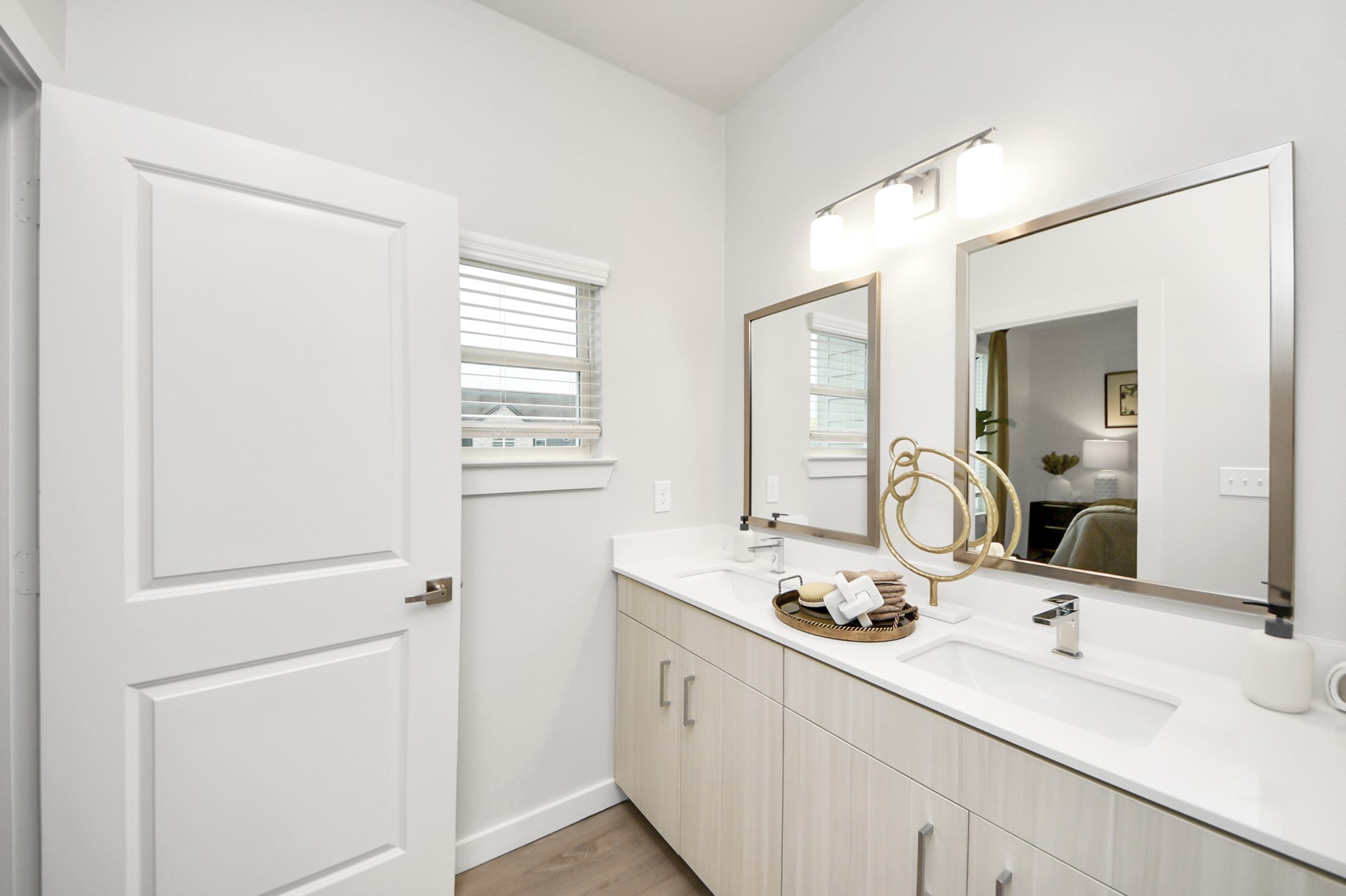 7306 Corey Rushing Lane Richmond, TX 77407 - Photo 30 of 50 a bathroom with a sink and a mirror