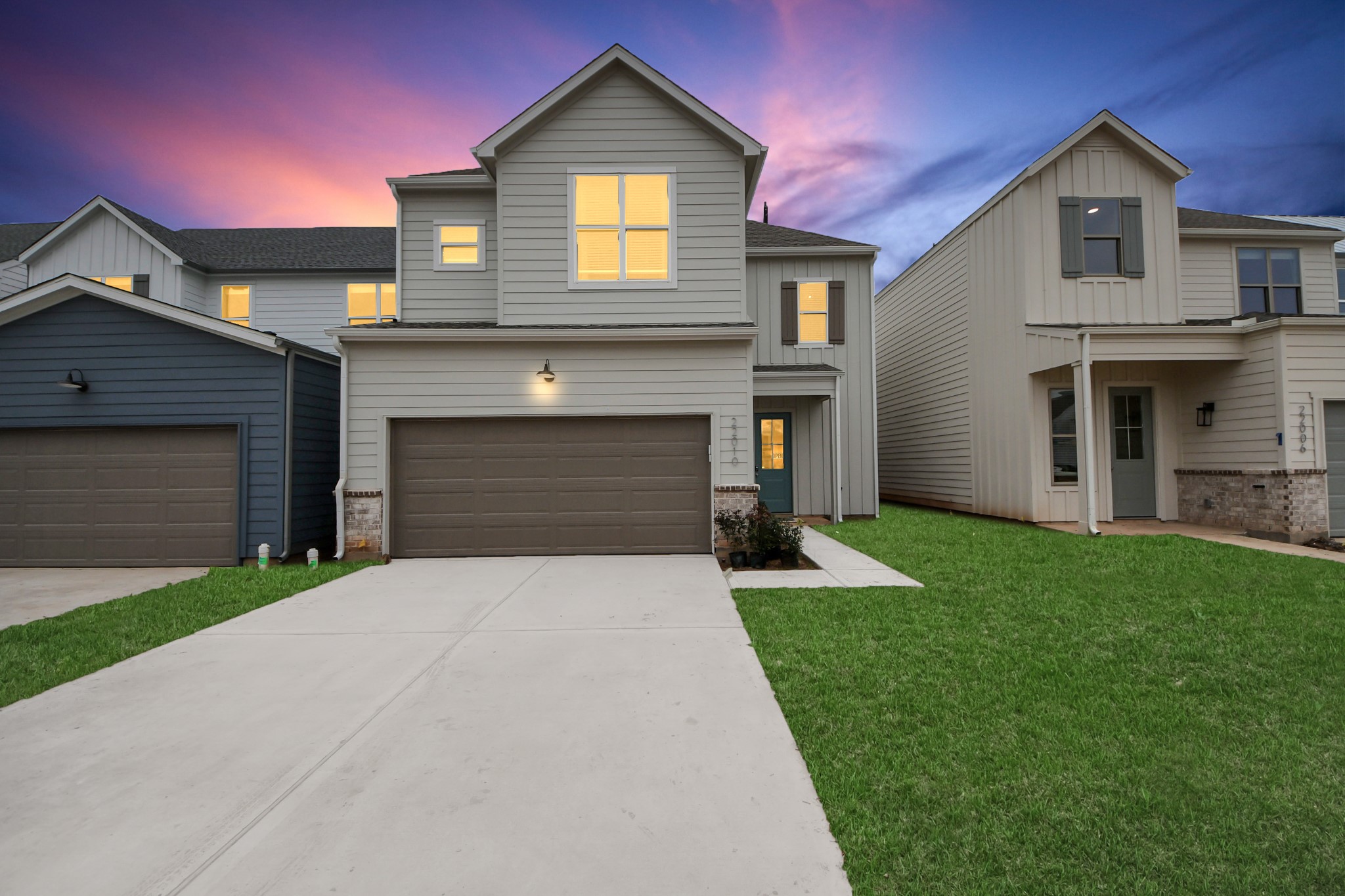 7306 Corey Rushing Lane Richmond, TX 77407 - Photo 33 of 50 a front view of a house with a yard and garage