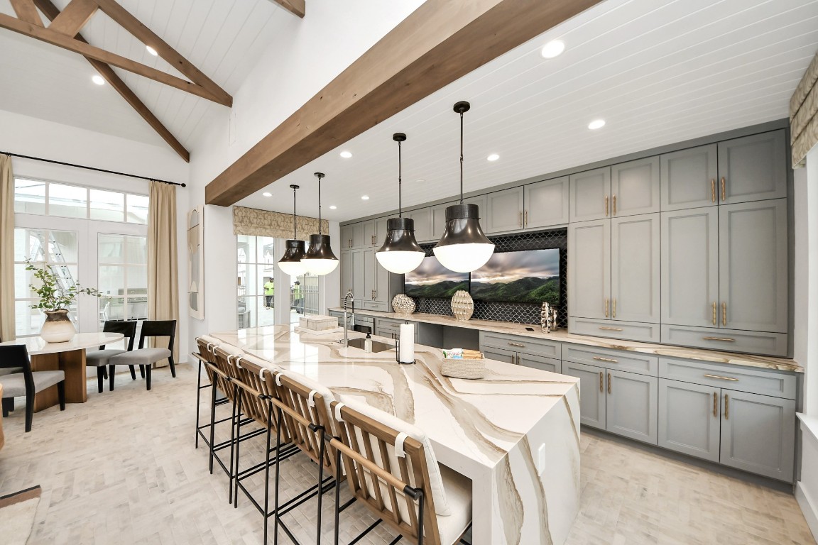 7306 Corey Rushing Lane Richmond, TX 77407 - Photo 41 of 50 a large kitchen with a table and chairs