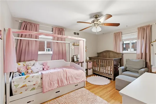 a bedroom with furniture and a window