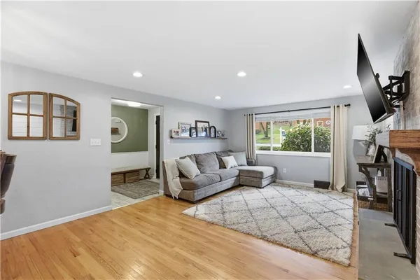 a bedroom with furniture and a window