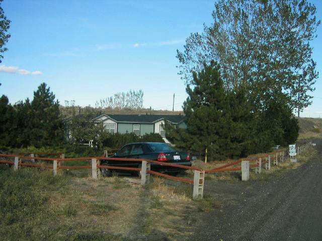 231 Hatton Road Tieton, WA 98947 - Photo 2 of 9 a backyard of a house with outdoor seating