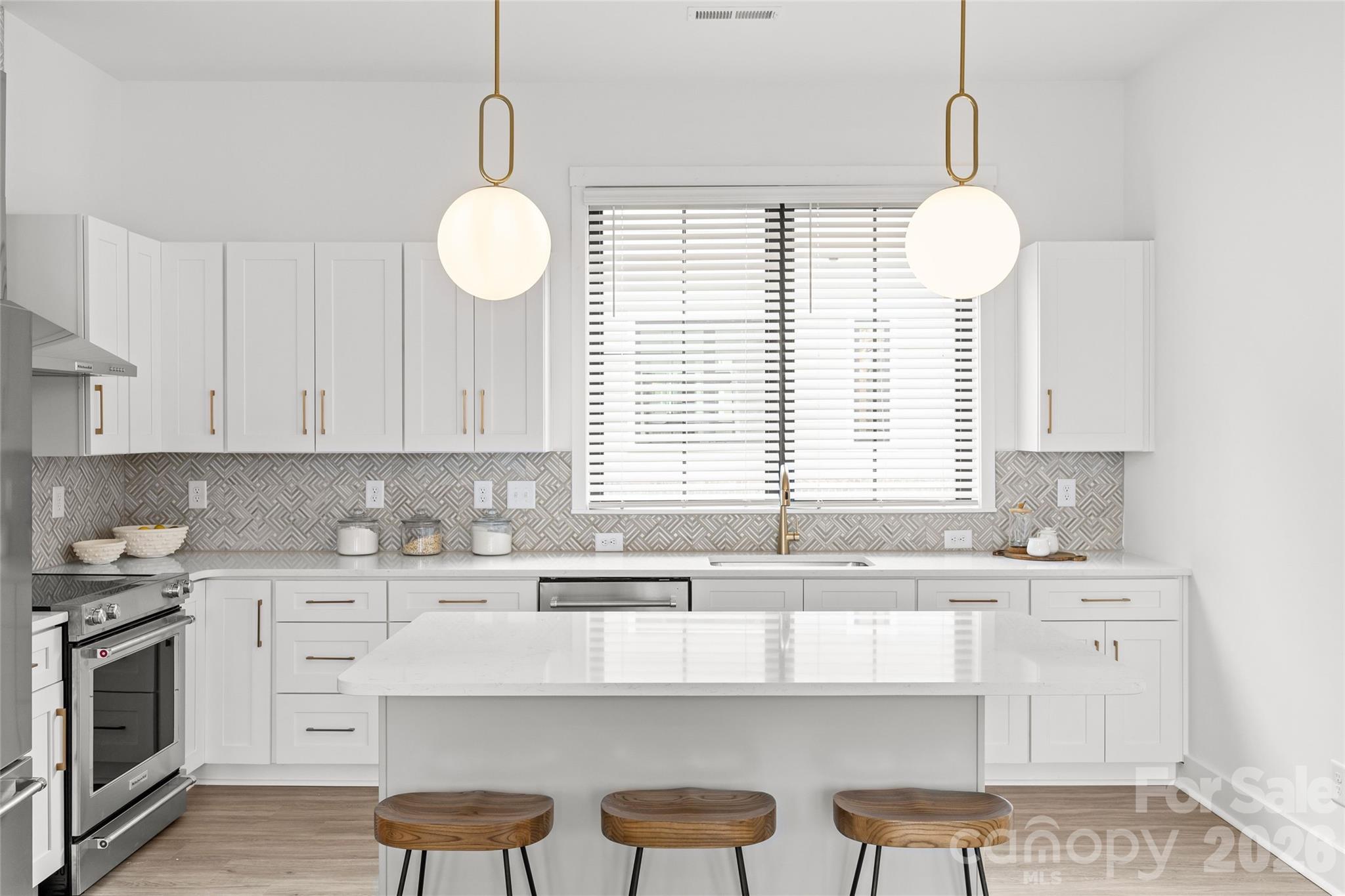 4041 South Tryon Street Charlotte, NC 28217 - Photo 15 of 45 a kitchen with a sink cabinets and window