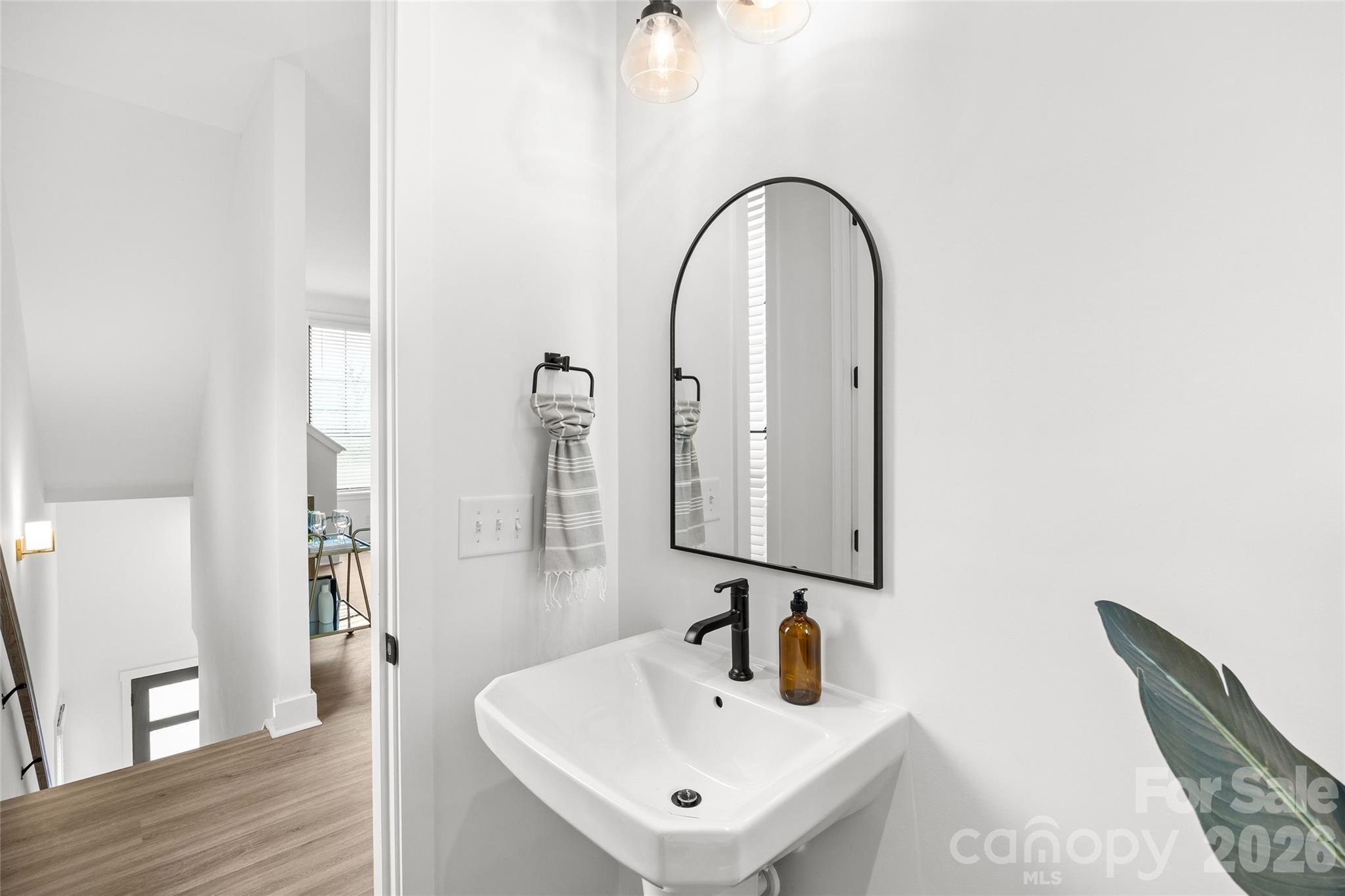 4041 South Tryon Street Charlotte, NC 28217 - Photo 23 of 45 a bathroom with a sink and a mirror