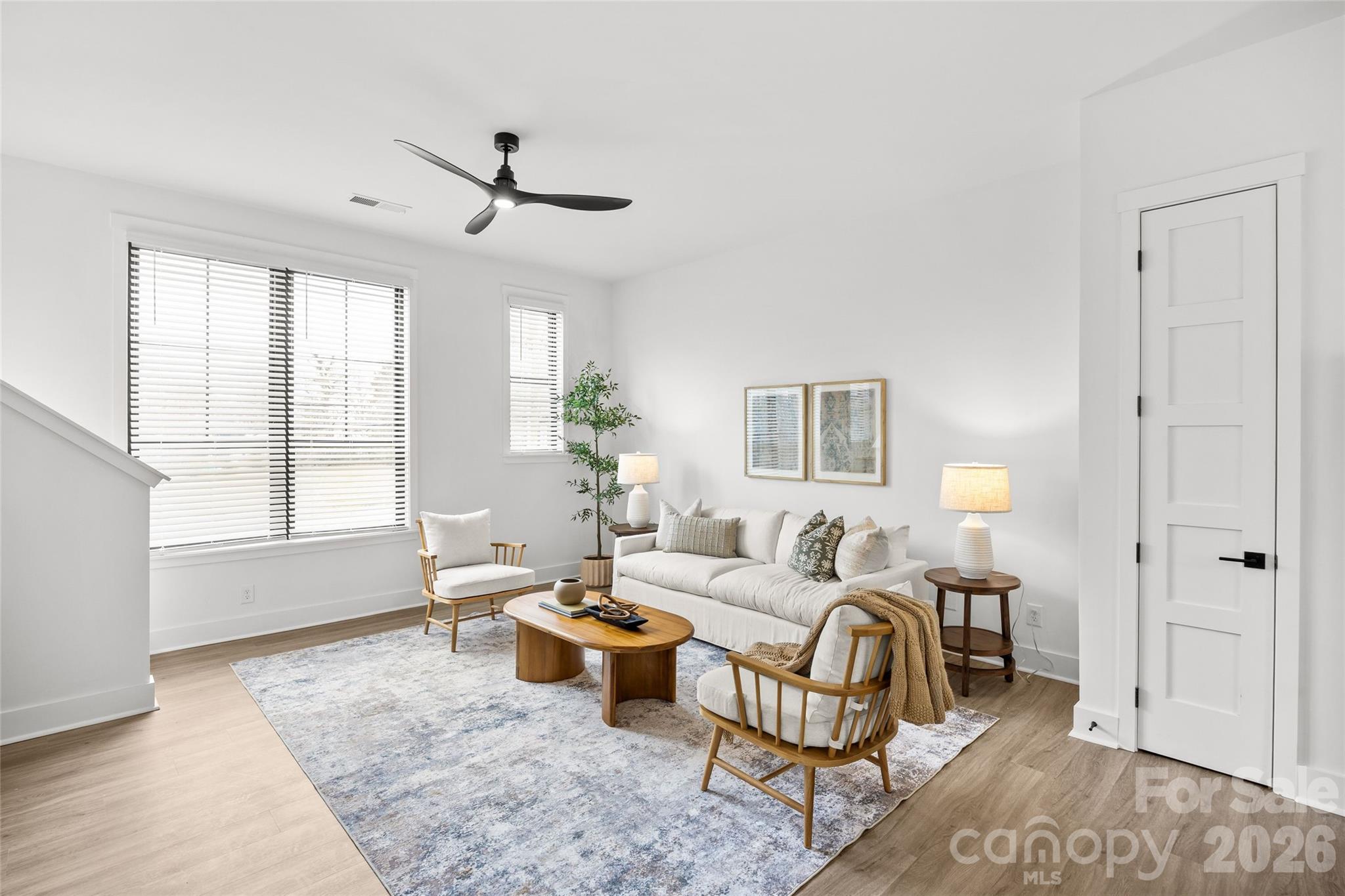 4041 South Tryon Street Charlotte, NC 28217 - Photo 24 of 45 a living room with furniture and wooden floor