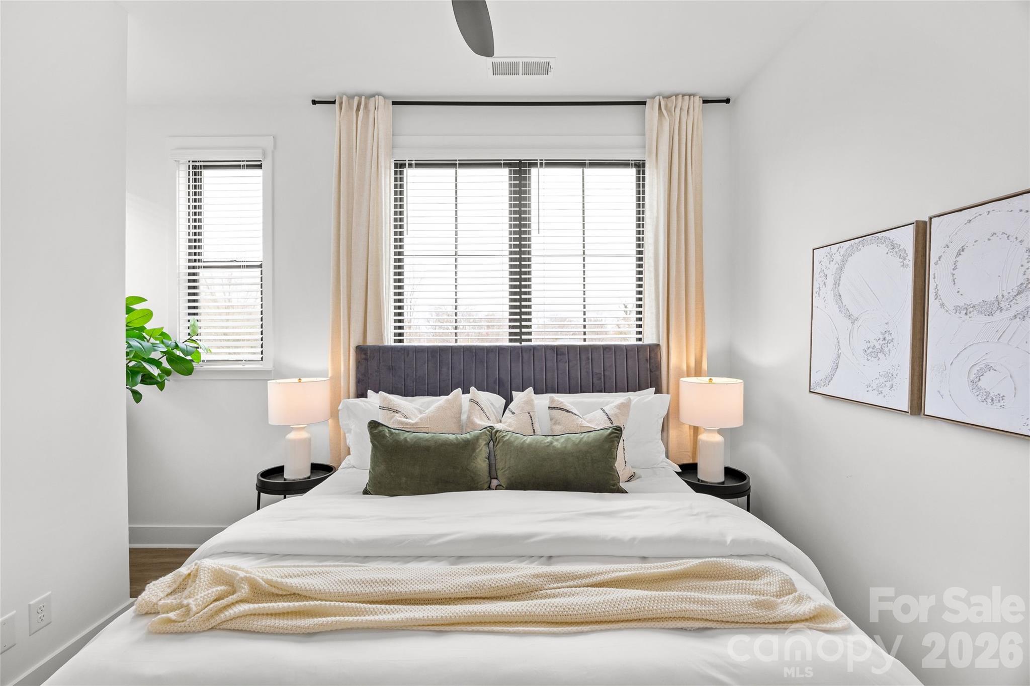 4041 South Tryon Street Charlotte, NC 28217 - Photo 32 of 45 a bedroom with a bed and a window