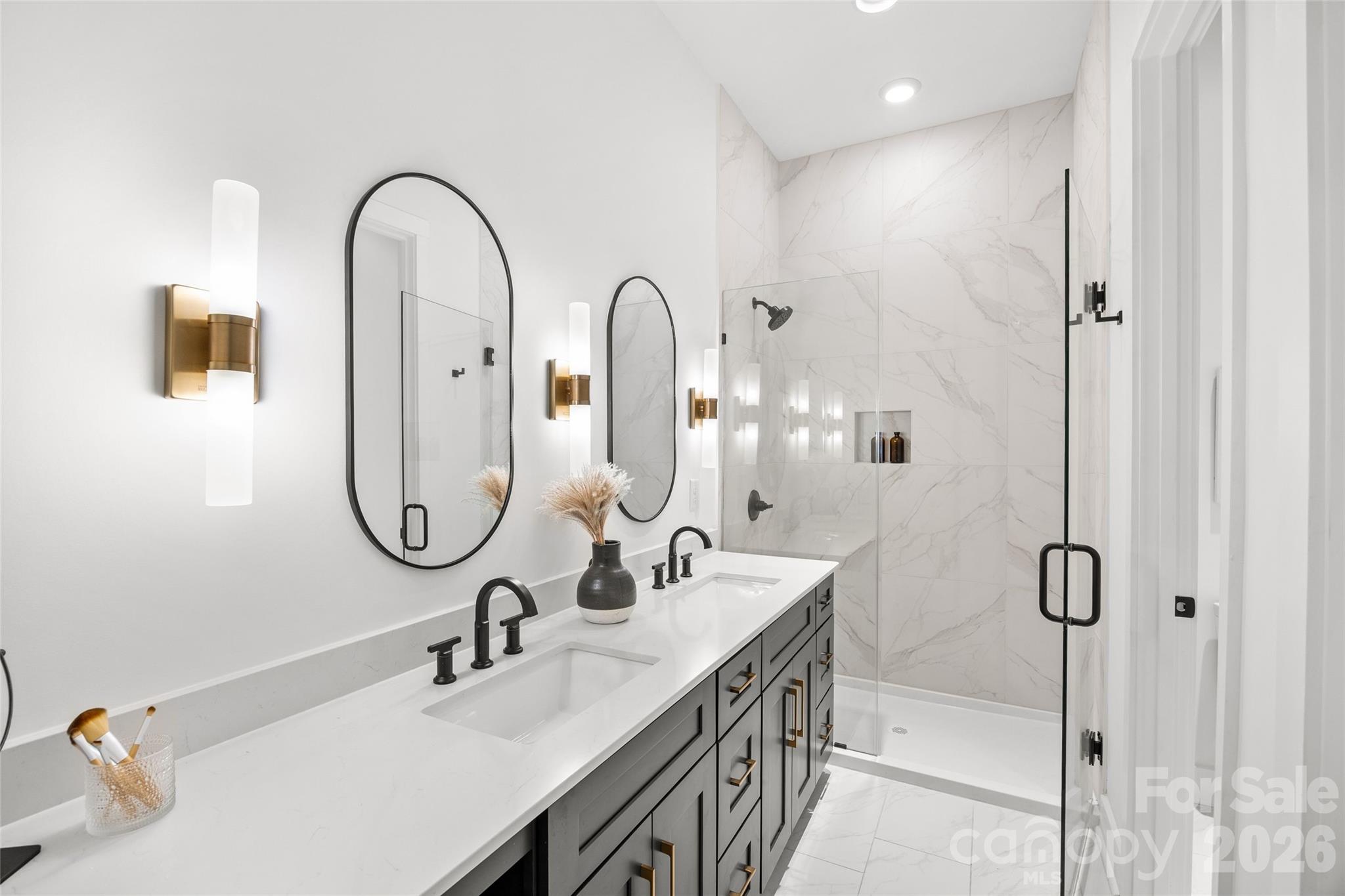 4041 South Tryon Street Charlotte, NC 28217 - Photo 39 of 45 a bathroom with a sink and mirror