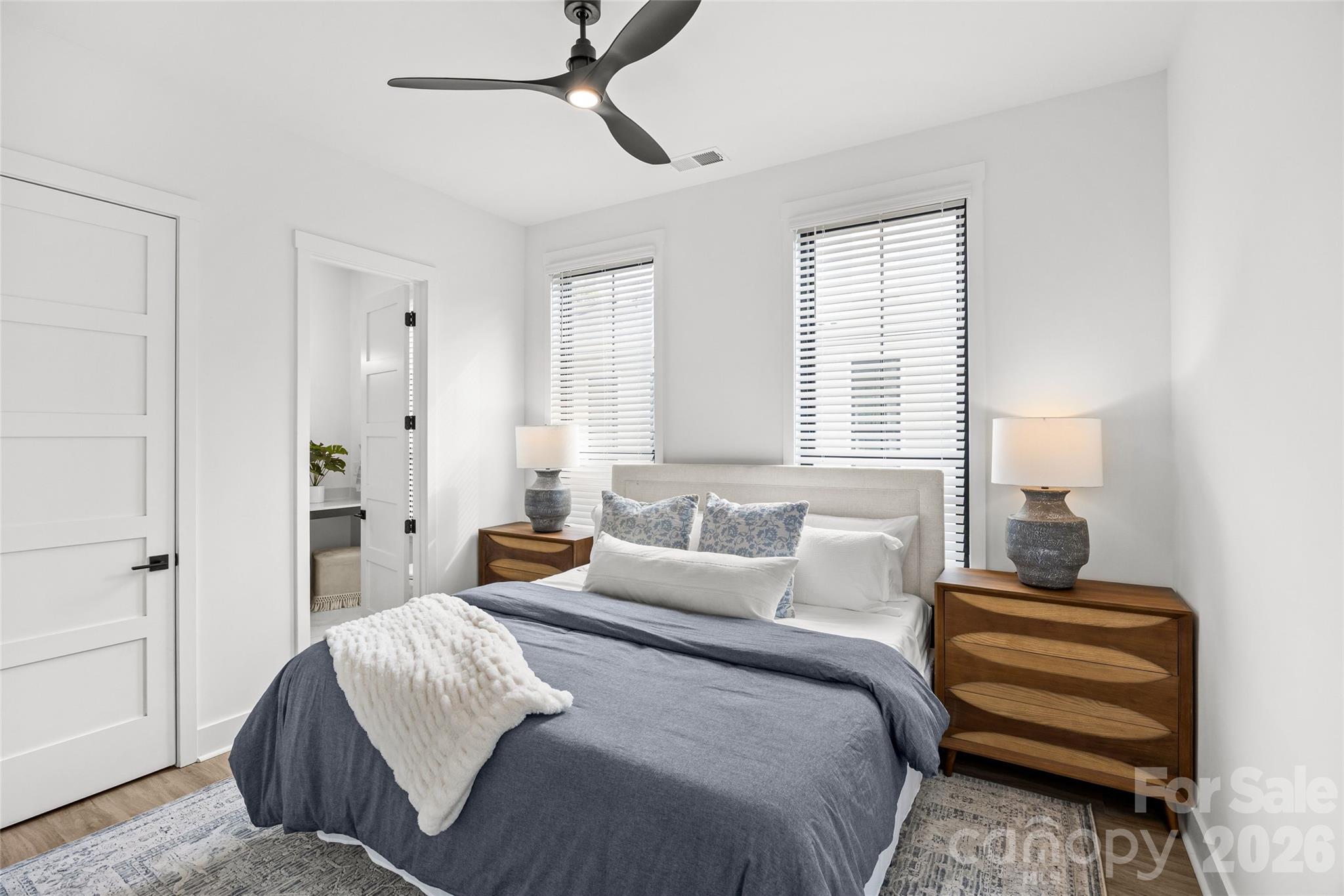 4041 South Tryon Street Charlotte, NC 28217 - Photo 40 of 45 a bedroom with a bed and a chandelier