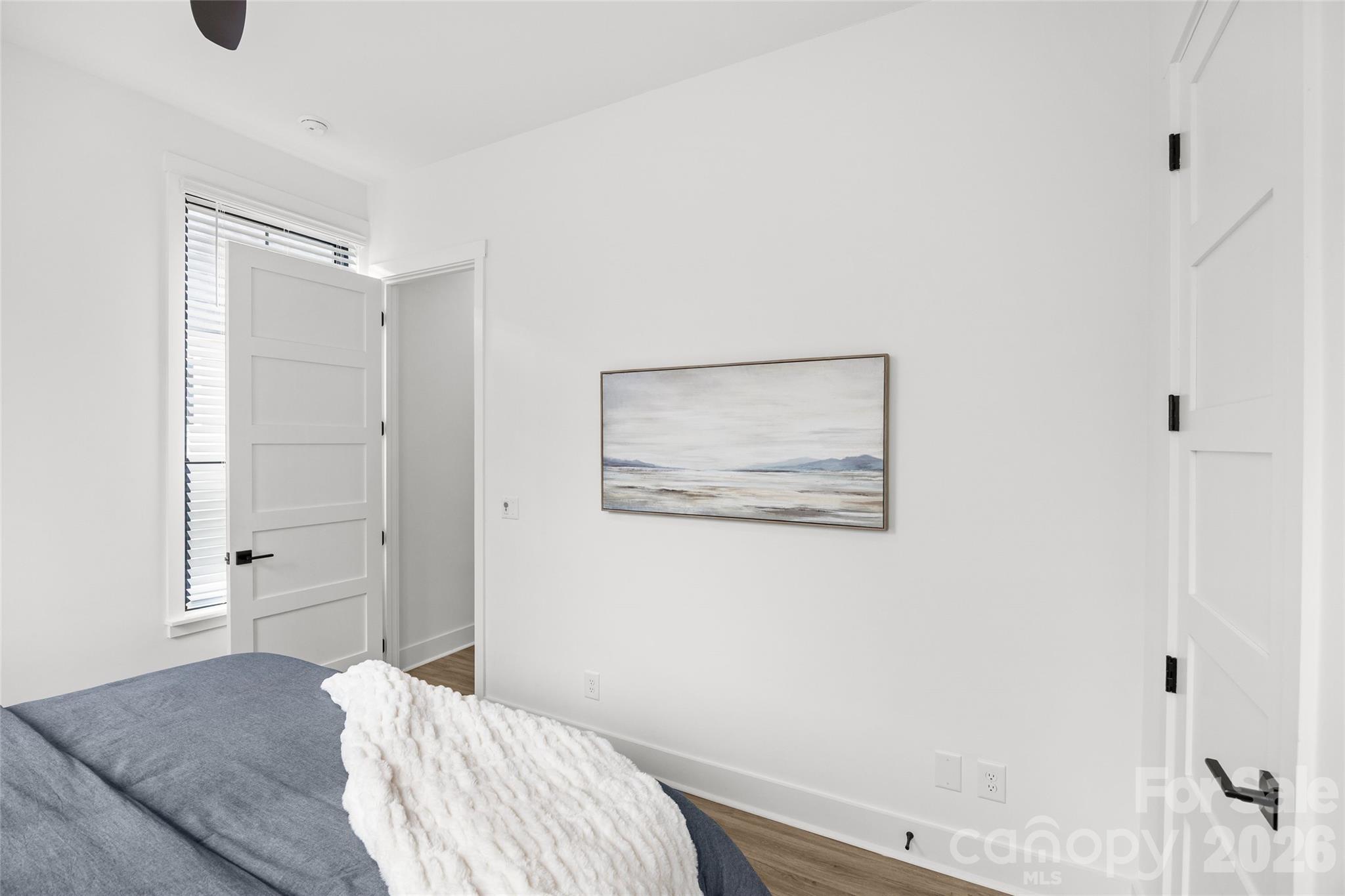 4041 South Tryon Street Charlotte, NC 28217 - Photo 41 of 45 a bedroom with a bed and a painting on the wall