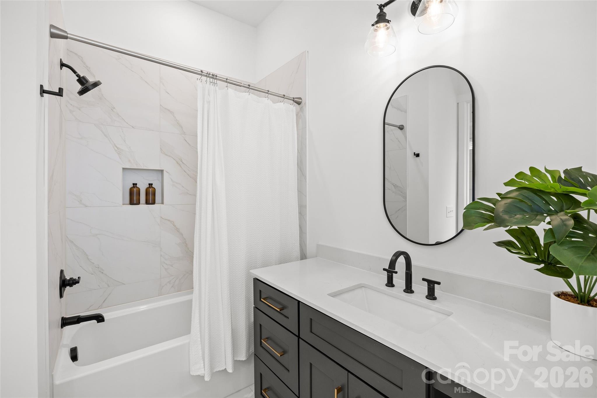 4041 South Tryon Street Charlotte, NC 28217 - Photo 43 of 45 a bathroom with a sink and a mirror